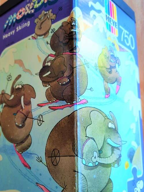 Heye `Heavy Skiing` 750 piece jigsaw puzzle by artist Mordillo