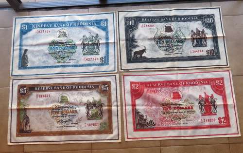 RHODESIAN DOLLAR TABLE CLOTH SET IN GOOD CONDITION-MEASURES 68X41 CM