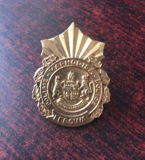 LEBOWA POLICE ,UNVOIDED CAP BADGE-2 LUGS