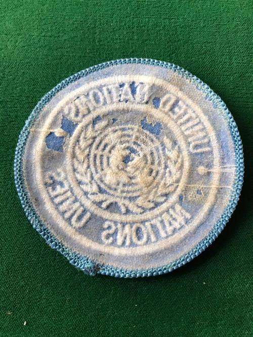 UNITED NATIONS EMBROIDERED CAP BADGE