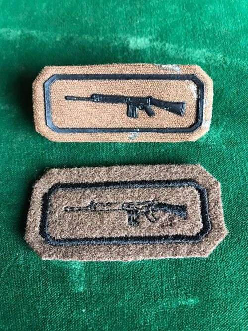 ARMY MARKSMAN PROFICIENCY BADGE- 1X EMBOSSED WITH 2 PINS-THE OTHER EMBROIDERED ON FELT BACKING