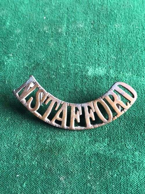 THE NORTH STAFFORDSHIRE REGT. TITLE-WORN POST 1902- 2 LUGS