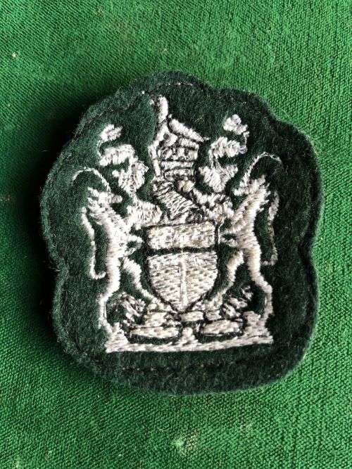 RHODESIAN ARMY WARRANT OFFICERS BADGE-EMBROIDERED ON GREEN FELT