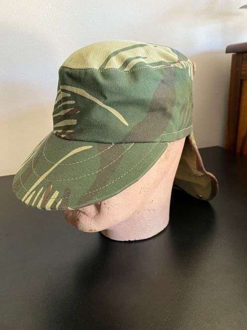 REPRODUCTION RHODESIAN CAMO FLAP CAP-SIZE XL INSIDE RING MEASURES 55CM-LABELLED AND DATED BY NIENMOL