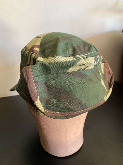 REPRODUCTION RHODESIAN CAMO FLAP CAP-SIZE XL INSIDE RING MEASURES 55CM-LABELLED AND DATED BY NIENMOL