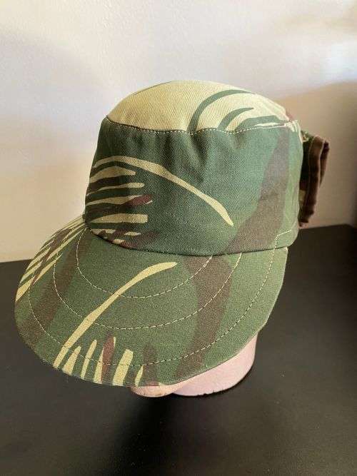 REPRODUCTION RHODESIAN CAMO FLAP CAP-SIZE XL INSIDE RING MEASURES 55CM-LABELLED AND DATED BY NIENMOL
