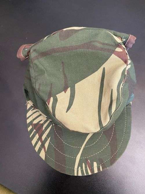 REPRODUCTION RHODESIAN CAMO FLAP CAP-SIZE XL INSIDE RING MEASURES 55CM-LABELLED AND DATED BY NIENMOL