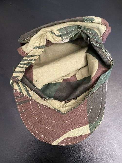 REPRODUCTION RHODESIAN CAMO FLAP CAP-SIZE XL INSIDE RING MEASURES 55CM-LABELLED AND DATED BY NIENMOL