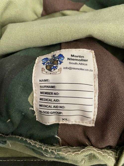 REPRODUCTION RHODESIAN CAMO FLAP CAP-SIZE XL INSIDE RING MEASURES 55CM-LABELLED AND DATED BY NIENMOL