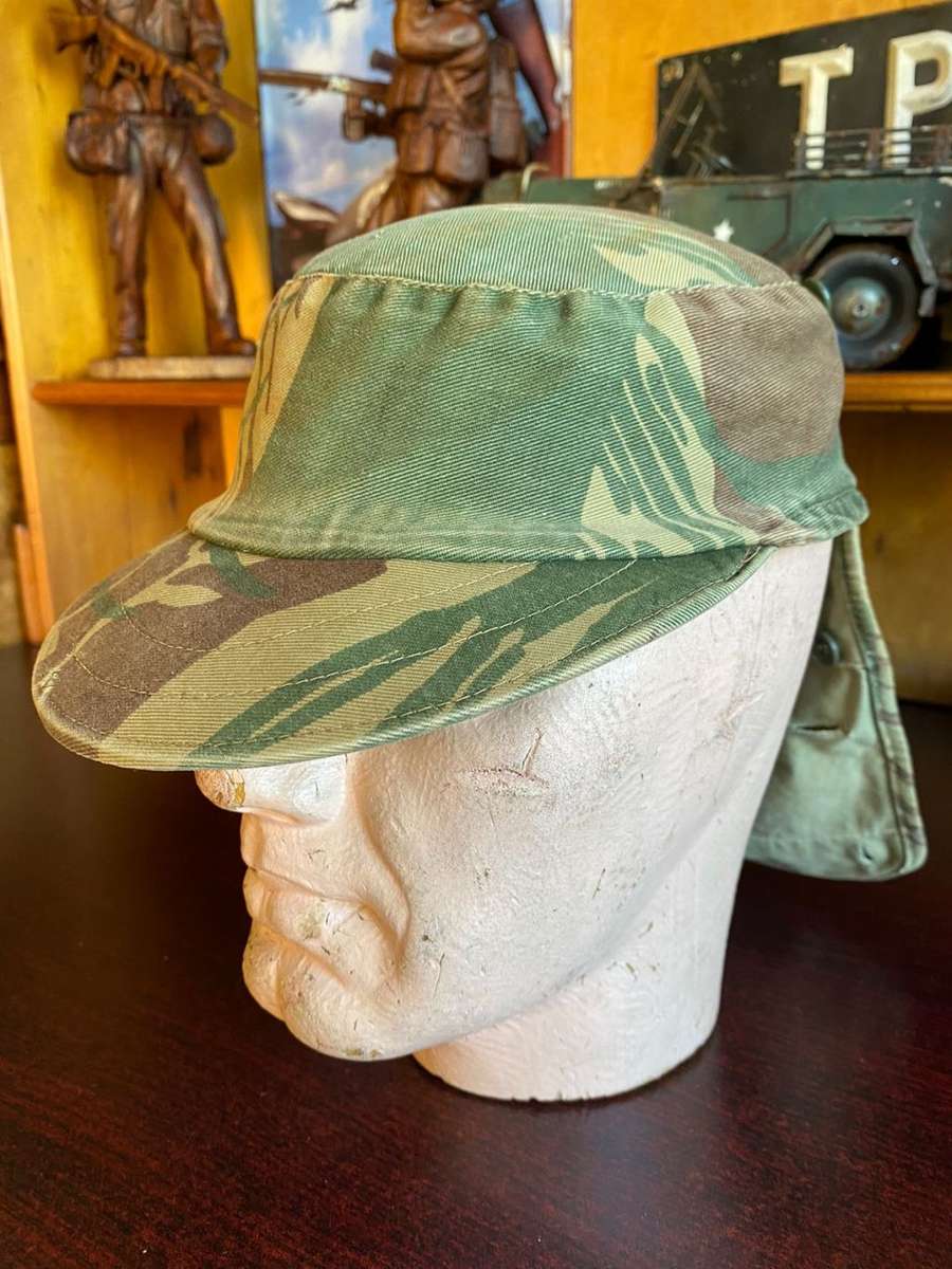 RHODESIAN CAMO FLAP CAP-USED BUT GOOD CONDITION-INSIDE RING-MEASURES 57 CM