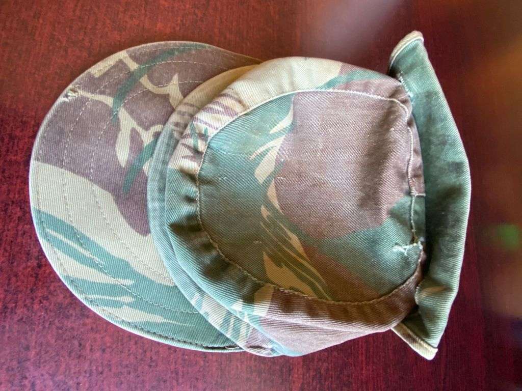 RHODESIAN CAMO FLAP CAP-USED BUT GOOD CONDITION-INSIDE RING-MEASURES 57 CM