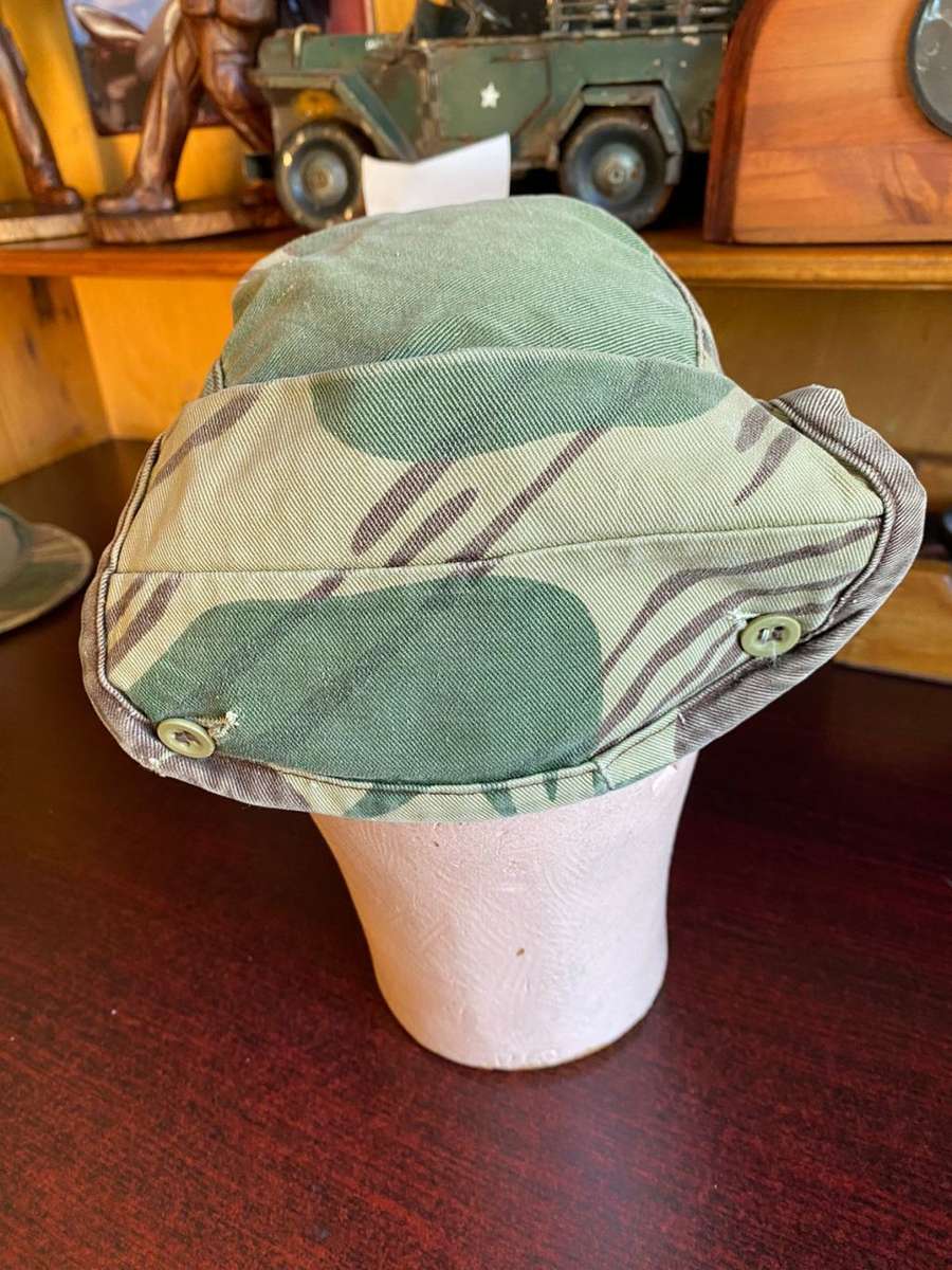 RHODESIAN CAMO FLAP CAP-USED BUT GOOD CONDITION-INSIDE RING MEASURES 56 CM