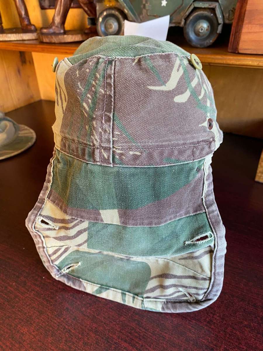 RHODESIAN CAMO FLAP CAP-USED BUT GOOD CONDITION-INSIDE RING MEASURES 56 CM