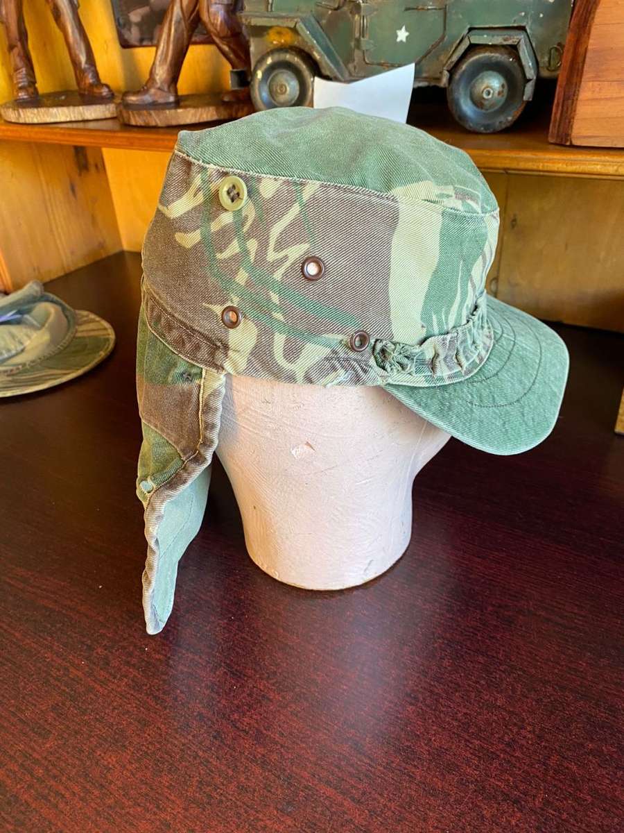 RHODESIAN CAMO FLAP CAP-USED BUT GOOD CONDITION-INSIDE RING MEASURES 56 CM