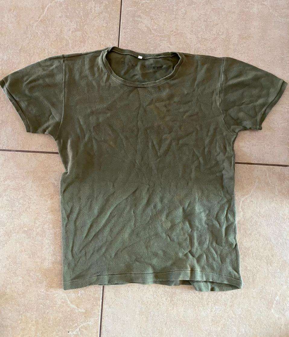 RHODESIAN T SHIRT-A SIZE MEDIUM- USED BUT GOOD-PEN MARKED-RAY WILSON