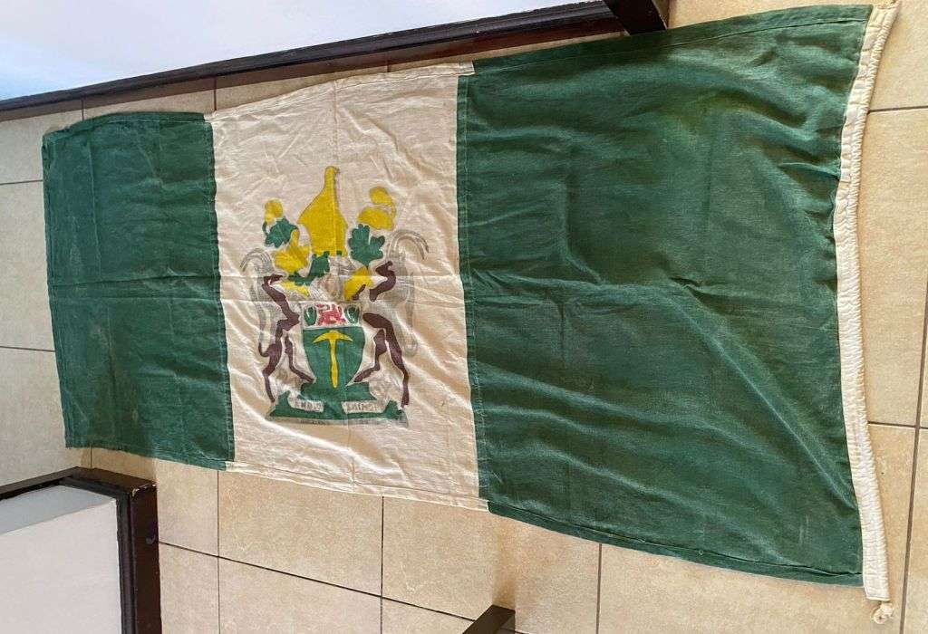 RHODESIAN FLAG-MEASURES 1,9 X 0,9 M-USED BUT GOOD-STITCHED PANELS-ONE SIDED-NO MAKERS LABEL