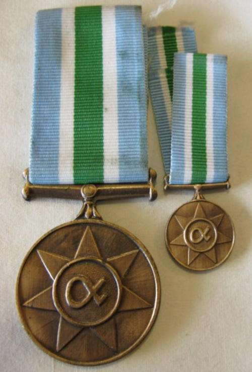 UNITAS MEDAL FULL SIZE WITH MINIATURE.  THE FULL SIZE NUMBERED.