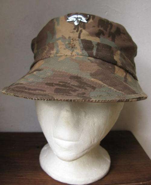 32 BATTALION CAMO CAP & BADGE-INSIDE RING MEASURES 55CM