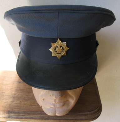 OLD SA POLICE PEAKED CAP WITH VOIDED CENTRE BADGE-WORN BY EUROPEANS