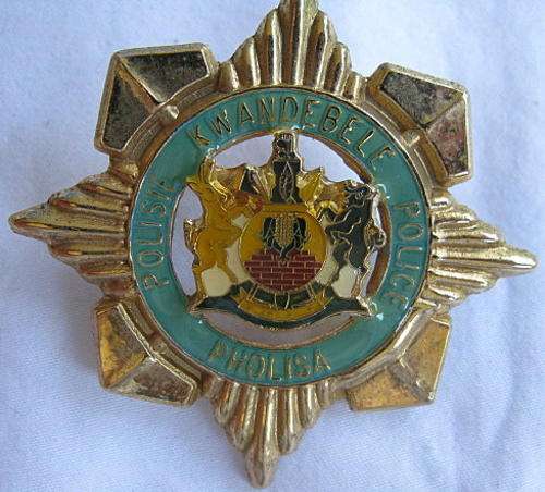 KWANDEBELE POLICE GILDING METAL AND ENAMEL OFFICERS CAP BADGE - 2 LUGS