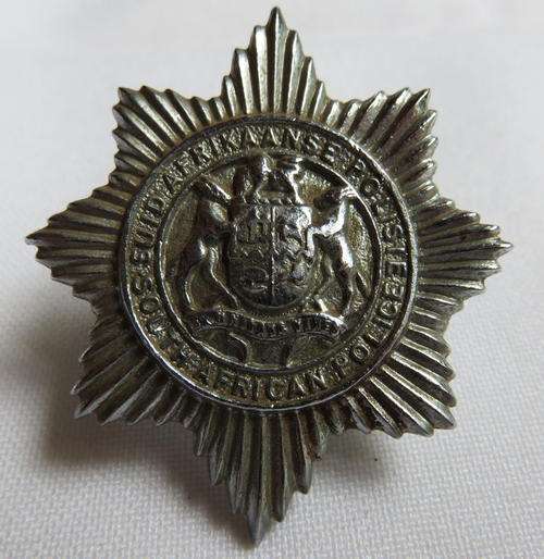 SA POLICE CHROMED WITH SOLID CENTRE,CAP BADGE,WORN 1957-1994-2X SCREW LUGS