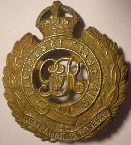 NO. 1292)  AUSTRALIAN - ENGINEERS CAP BADGE 1903-42 - BRASS - 2 STUDS.