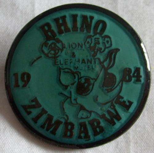 A1691 - MOTORCYCLE - RHINO 1984 LION & ELEPHANT HOTEL - ZIMBABWE STICKPIN BADGE.