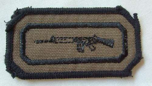 NO. 5541)  SADF MARKSMAN QUALIFICATION BADGE BLACK EMBROIDERED ON NUTRIA,