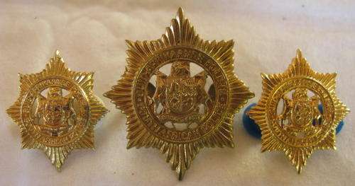 S.A. POLICE CAP + COLLAR BADGES WITH VOIDED CENTRE WORN BY EUROPEANS POST 1957.  LUGS INTACT