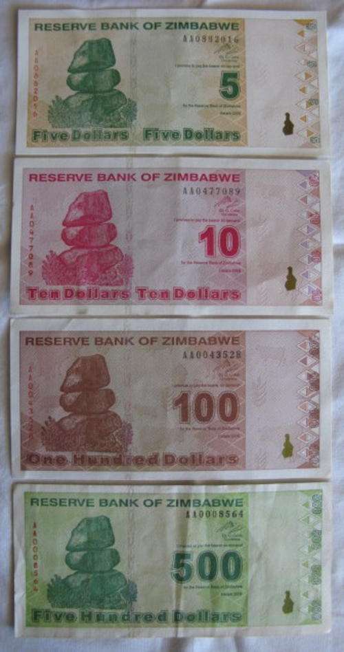 ZIMBABWE 2009 RARE AA PREFIX 5/10/100/500 DOLLAR NOTES IN UNC CONDITION - EXCEPT FOR $500 NOTE THAT