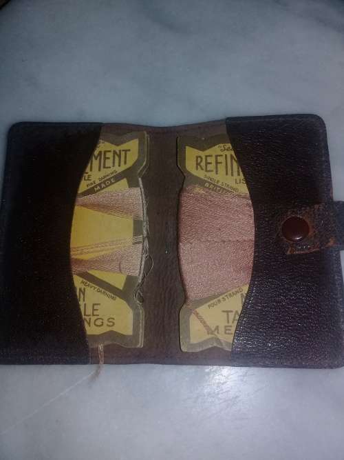 old neddle sowing kit in leather pouch