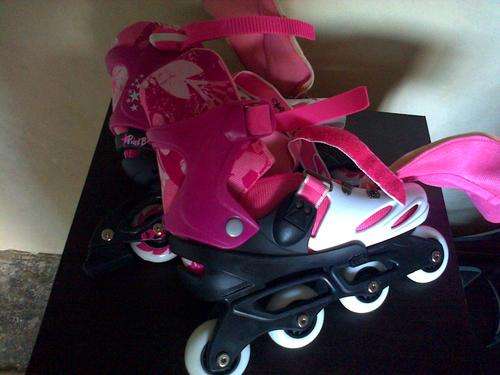never before worn pink rollerblades