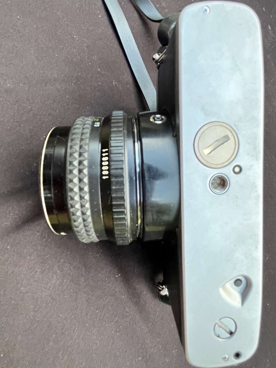 MAKINON zoom lense and MINOLTA film camera.