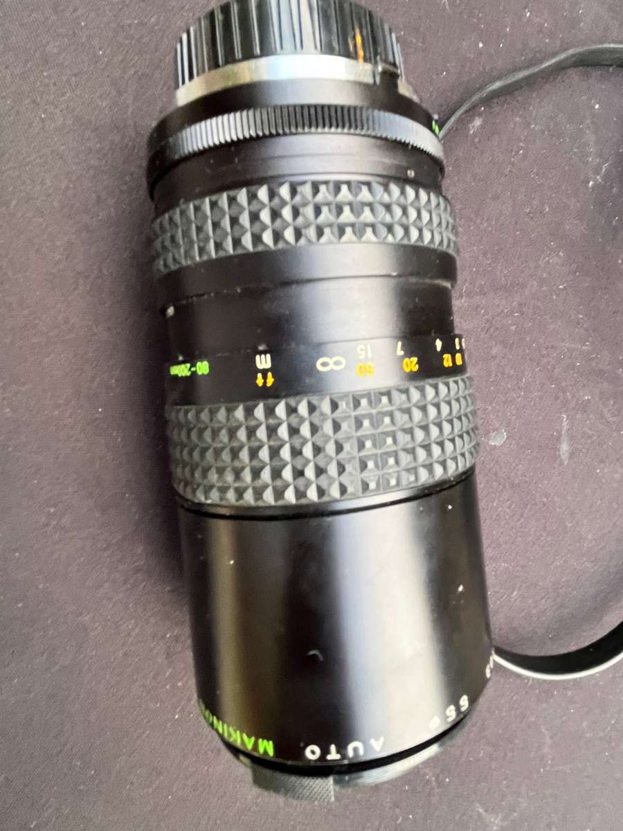 MAKINON zoom lense and MINOLTA film camera.