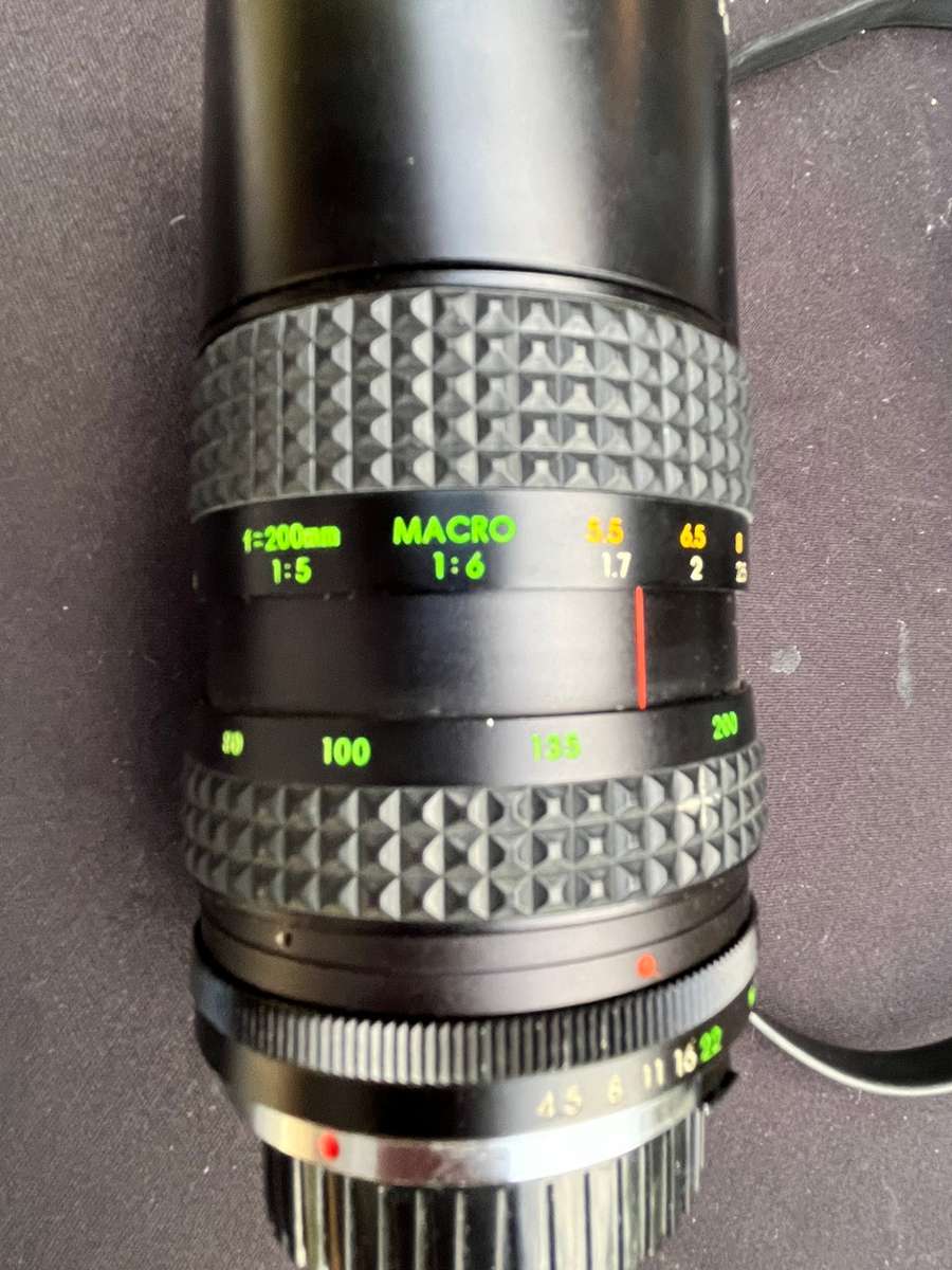 MAKINON zoom lense and MINOLTA film camera.