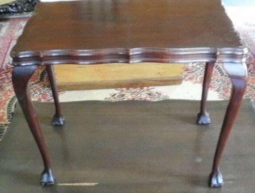 A MAHOGANY BALL AND CLAW SIDE TABLE