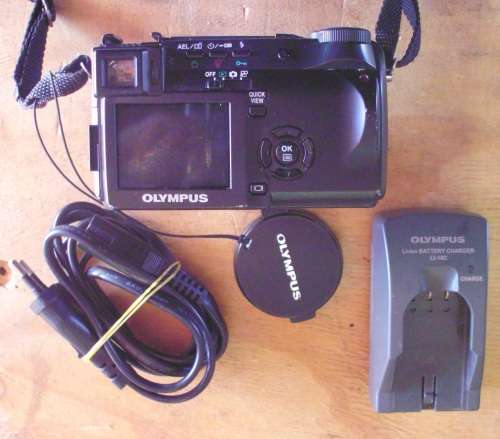Camera Olympus with charger and battery for spares.