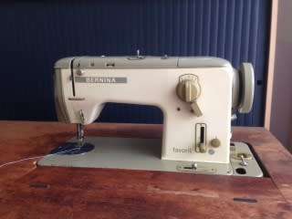 Bernina Model 740 Sewing Machine with cabinet and accessories , good condition, recently serviced