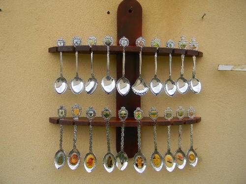 A variety of SA places in chrome plated spoons with rack in excellent condition.