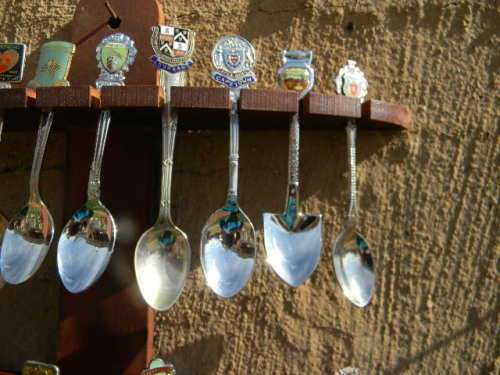 20 Antique collector spoons of SA towns in different shapes good condition with rack.