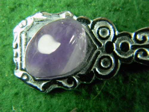 Crome plated spoon with gem stone in good condition