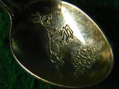 Sun City copper spoon in fair condition
