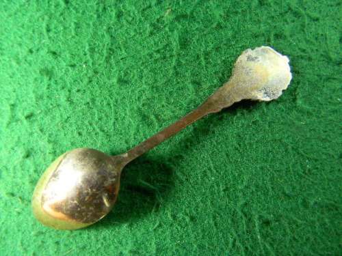 Sun City copper spoon in fair condition