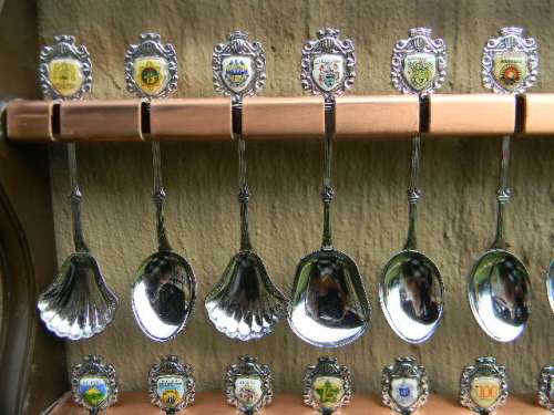 36 Souvenir spoons in good condition from South africa with free rack