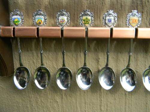 36 Souvenir spoons in good condition from South africa with free rack