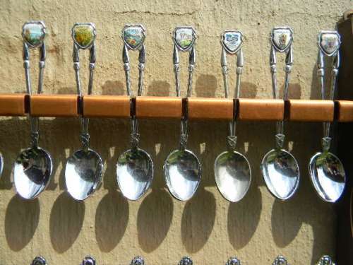 .36 souvenir Spoons off South Africa in good condition with free rack.