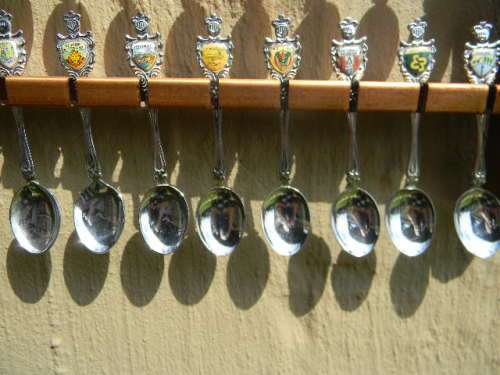 36 Souvenir spoons from South Africa in good condition with free rack