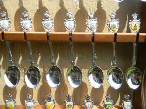 36 Souvenir spoons from South Africa in good condition with free rack