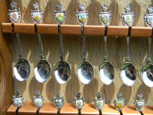 36 Souvenir spoons from South Africa in good condition with free rack