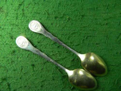 2 very oldflower spoons with an crab at back brass and silver plated as per pictures